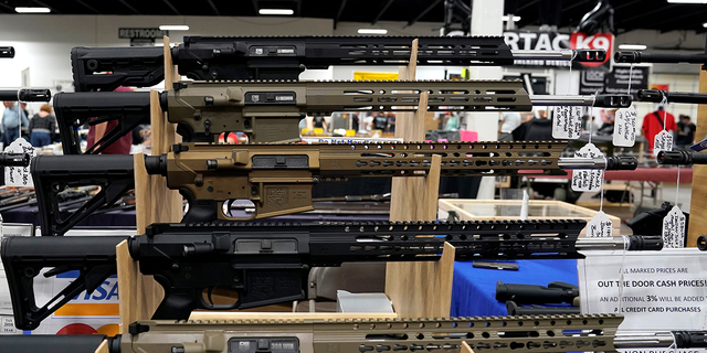 AR-15 rifles are displayed for sale at the Guntoberfest gun show in Oaks, Pennsylvania, Oct. 6, 2017.