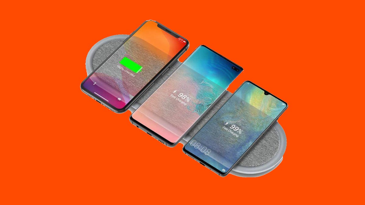 A charging pad with three phones