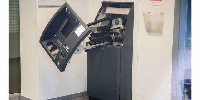 A destroyed cash machine stands in a branch of the Hannoversche Volksbank. German authorities arrested nine suspects in connection with ATM explosions across the country.