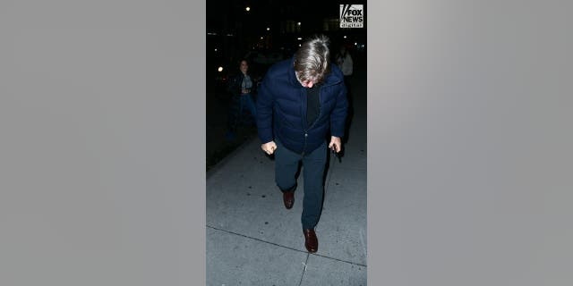 Alec Baldwin braves the cold weather while walking to a members-only club in New York.