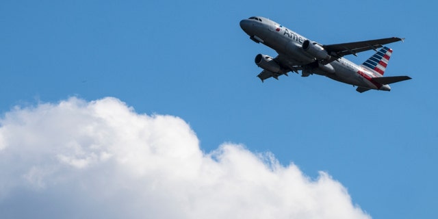 An American Airlines plane takes off from Ronald Reagan Washington National Airport November 23, 2021, in Arlington, Virginia. 