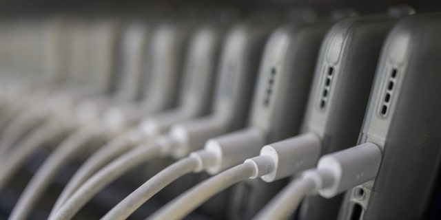 Phones are charged before the dispatch inside the Realme factory in Greater Noida, India, Wednesday, June 1, 2022. 