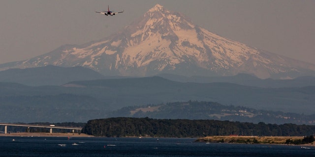 Mount Hood beyond the Willamette River during a heatwave in Portland, Oregon, U.S., on Monday, June 28, 2021. 