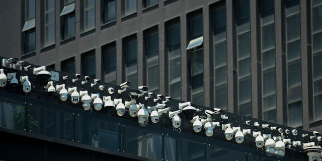 Surveillance cameras being installed on the Dahua Technologies office building in Hangzhou, in China's Zhejiang province on May 29, 2019.