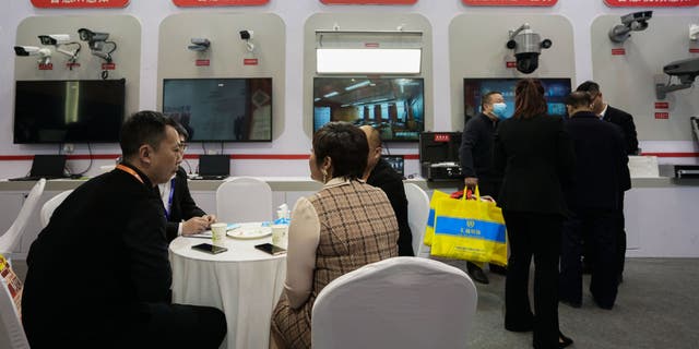 People visit the Hikvision booth during the World Digital Industry Expo on March 24, 2021, in Zhengzhou, China.