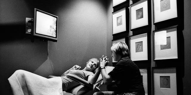 Partners Jen and Jane hold hands during the fertility process at a fertility clinic in Sydney, Australia.  