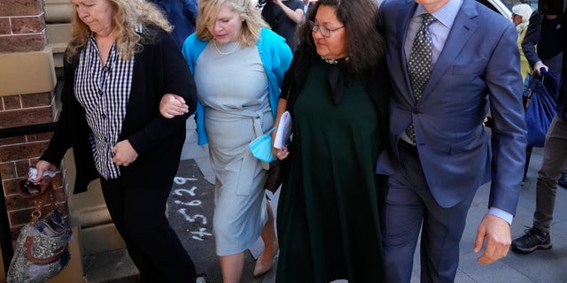 Steve Johnson, right, arrives with his family at the Supreme Court in Sydney on May 2, 2022, for a sentencing hearing in the murder of their brother, Scott Johnson. An Australian pleaded guilty on Feb. 23, 2023, to the manslaughter of Scott Johnson.