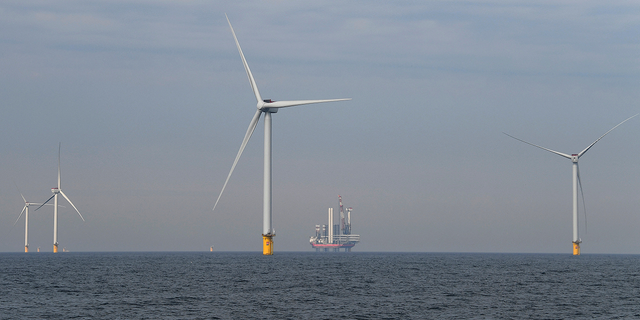 Wind turbines are seen at the North Sea in Scheveningen, Netherlands.
