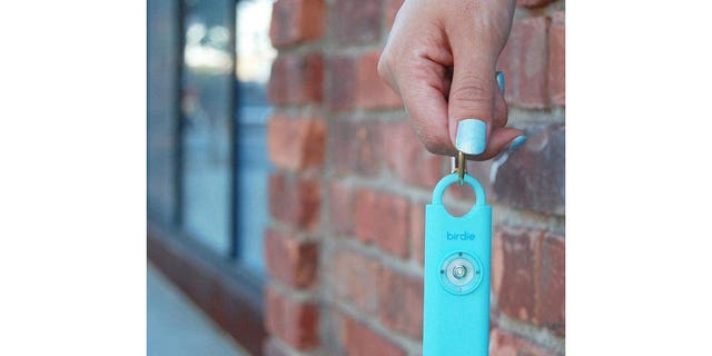 A She's Birdie keychain that emits an alarm and strobe light when activated.