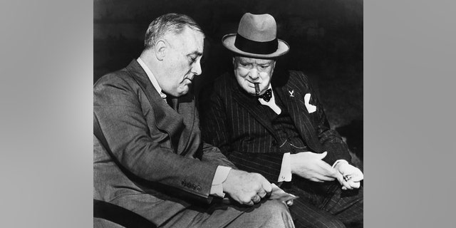 Franklin D. Roosevelt and Sir Winston Churchill discuss details of Germany's surrender in one of their last meetings at Casablanca. Both leaders agreed to seek the unconditional surrender of Germany. 