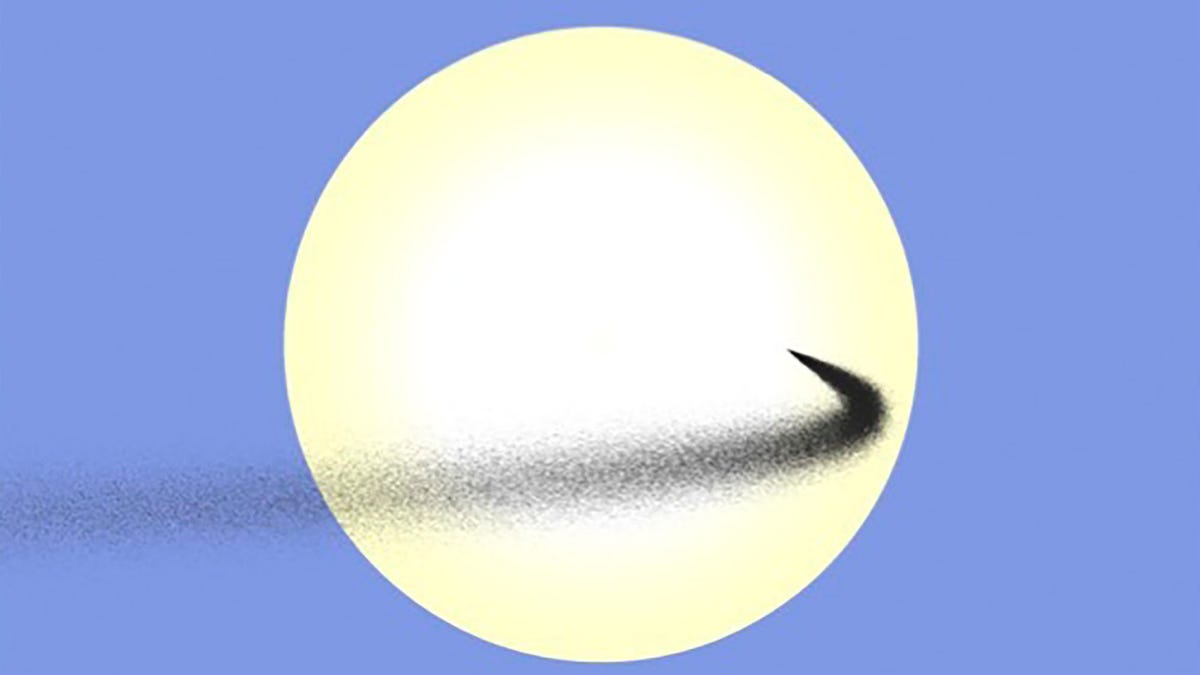 A large yellow orb is fronted by a snaking tail of dark particles which disappears off the side of the image