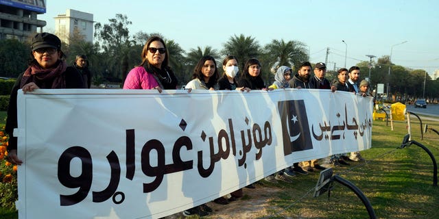 Members of a civil society group take part in a rally during a prayer ceremony for victims of Monday's suicide bombing in Peshawar, in Lahore, Pakistan, on Feb. 4, 2023.