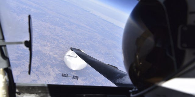 A pilot looks down upon a suspected Chinese spy balloon on Feb. 3, 2023. 