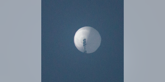 A balloon flies in the sky over Billings, Montana, Feb. 1, 2023, in this picture obtained from social media.