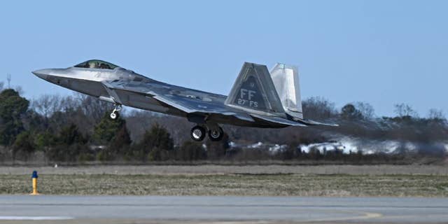 An F-22 fighter jet takes off from Langley Air Force Base. 