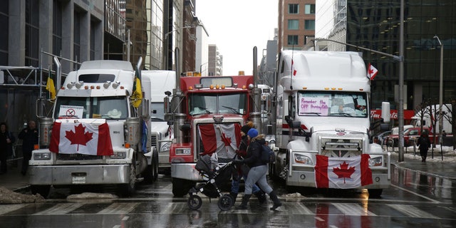 Trucks block a section of Metcalfe Street during a "Freedom Convoy" demonstration in downtown Ottawa, Canada, on Feb. 10, 2022.
