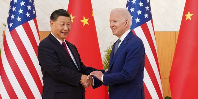 U.S. President Joe Biden shakes hands with Chinese President Xi Jinping. The pair are now squaring off over a Chinese balloon shot down by the U.S.
