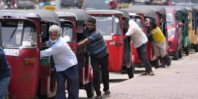 Auto rickshaw drivers line up to buy gas in Colombo, Sri Lanka, on April 13, 2022. China expressed support for Sri Lanka ahead of a meeting on Feb. 17, 2023, regarding the nation's debt.