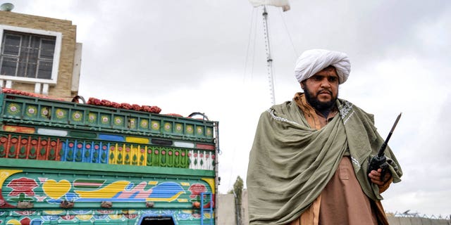 A Taliban security personnel stands guard at the Afghanistan-Pakistan border in Spin Boldak on Dec. 12, 2022. 