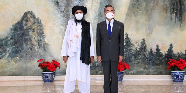 Chinese State Councilor and Foreign Minister Wang Yi, right, meets with Mullah Abdul Ghani Baradar, political chief of Afghanistan's Taliban, in north China's Tianjin, July 28, 2021.