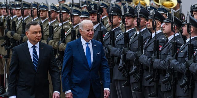 Polish President Andrzej Duda, left, and President Joe Biden inspect the Polish guard at the presidential Palace in Warsaw, Poland. Biden visited Poland and met with the Polish president as well as U.S. troops stationed near the Ukrainian border, bolstering NATO's eastern flank.