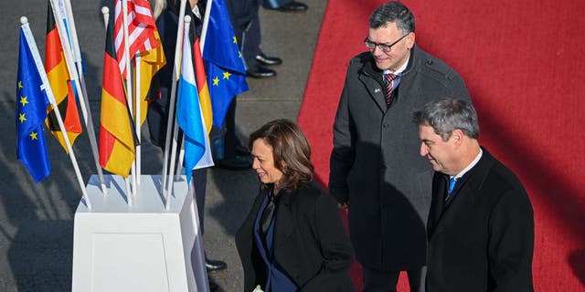 Vice President Kamala Harris is greeted by the prime minister of Bavaria, Markus Söder, as she arrives at Munich Airport on Feb. 16, 2023, in Freising, Germany.