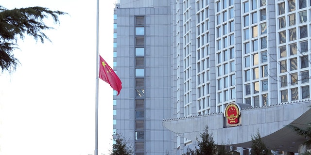 A Chinese national flag is flown at half-mast to mourn the death of Comrade Jiang Zemin at the Ministry of Foreign Affairs in Beijing Dec. 1, 2022. 