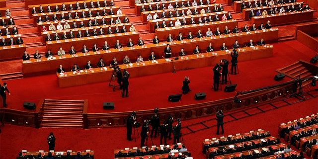 Chinese officials and delegates attend the closing session of the National People's Congress at the Great Hall of the People in Beijing May 28, 2020.