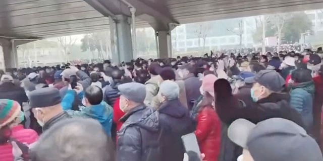 Demonstrators gather outside Zhongshan park to protest changes to medical benefits in Wuhan, China, on Feb. 15, 2023