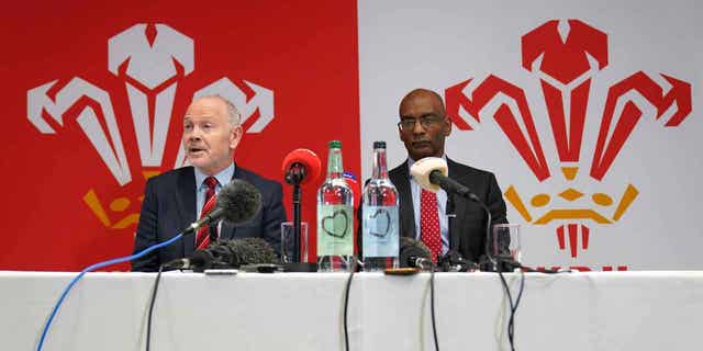 Welsh Rugby Union chairman Leuan Evans, left, and acting chief executive Nigel Walker are shown during a press conference. Evans has vowed to remain as Welsh Rugby Union chair despite allegations of a "toxic culture" at the organization that resulted in chief executive Steve Phillips' resignation on Sunday. Phillips' resignation came after a turbulent week in Welsh rugby following a documentary airing allegations of misogyny, sexism, racism, and homophobia. The mail-voiced choir will not sing "Delilah" before Wales' match in the Six Nations, or at future games, due to the allegations.