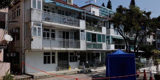 Cordons lines are seen outside a village house where part of Abby Choi's body was found in Hong Kong Feb. 27, 2023. 