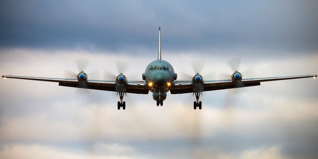 Aa Russian IL-20M (Ilyushin 20m) aircraft is seen landing at an unknown location.