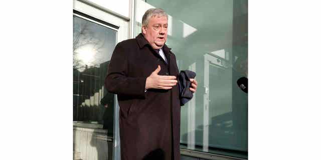 Belgian lawmaker Marc Tarabella speaks with the media in Brussels on Dec. 13, 2022. Tarabella has been detained for questioning in connection with a corruption scandal.