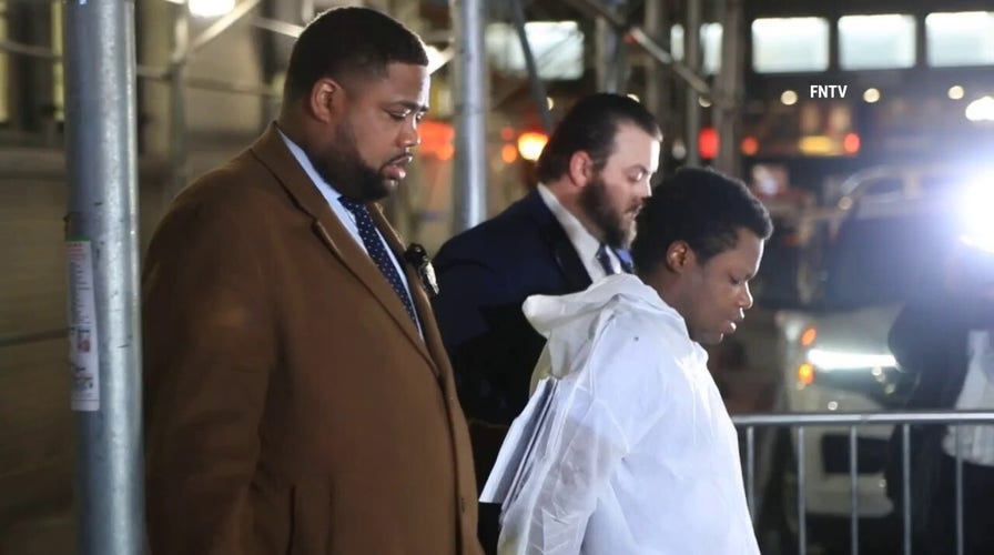 Accused NYC serial rapist escorted out of police precinct on way to court