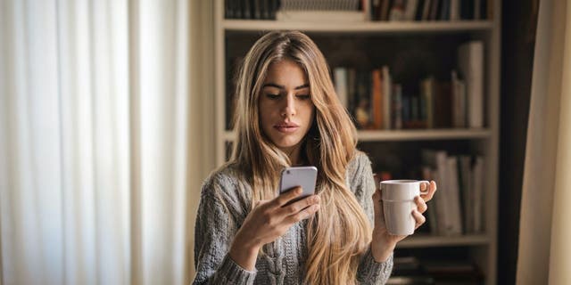 Women looking at her iPhone