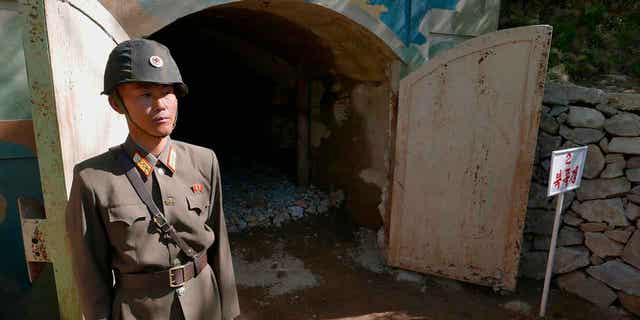 A guard stands at the entrance of the north tunnel at North Korea's nuclear test site shortly before it was blown up on May 24, 2018. Human rights advocates on Feb. 21, 2023, urged South Korea to offer exposure tests to hundreds of North Korean escapees who had previously lived near the country’s nuclear testing ground.