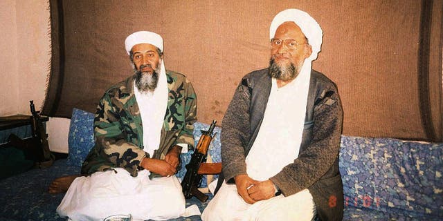 Usama bin Laden and al-Qaeda leader Ayman Al Zawahri sitting side by side