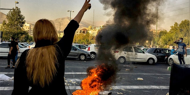 Iranians protest the death of 22-year-old Mahsa Amini after she was detained by the morality police, in Tehran, Oct. 1, 2022.