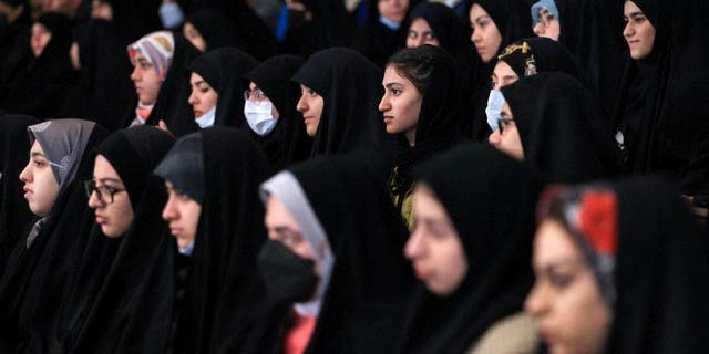 Female students attend a National Student Day ceremony at Tehran University in Iran, Dec. 7, 2022.