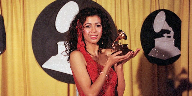 Irene Cara, best known as a singer of movie themes, holds her Grammy award for the song "What a Feeling" from the movie "Flashdance." She won the award for Best Pop Vocal performance by a Female.