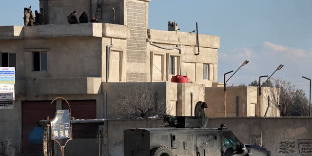 FILE PHOTO: Members of the Syrian Democratic Forces (SDF) deploy around Ghwayran prison, which holds ISIS detainees, in Syria's northeastern city of Hasakeh on January 25, 2022.