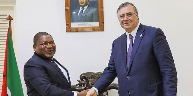 Mozambican President Filipe Nyusi shakes hands TotalEnergies CEO Patrick Pouyanne. Mozambique has become a hotbed for Islamic insurgents, some of whom killed a representative of Doctors Without Borders after the NGO inspected their region's humanitarian situation.
