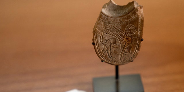 A 2,700-year-old ivory incense spoon displayed at the Palestinian Ministry of Tourism and Antiquities in the West Bank city of Bethlehem, Thursday, Jan. 19, 2023. 