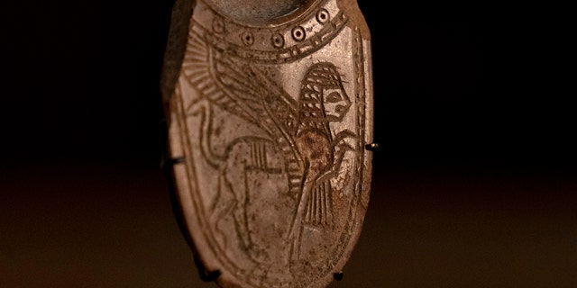 A 2,700-year-old ivory incense spoon plundered from a site in the occupied West Bank.