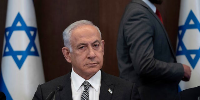Israeli Prime Minister Benjamin Netanyahu chairs the weekly cabinet meeting in Jerusalem, Sunday, Feb.12, 2023.