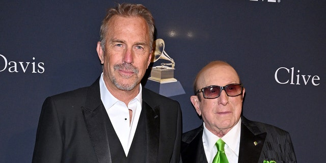 Kevin Costner, left, and Clive Davis attend the Pre-Grammy Gala on Saturday night.