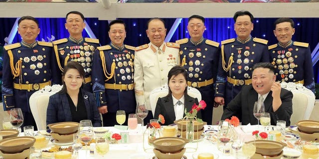 Kim Jong Un, with his wife Ri Sol Ju, left, and daughter Ju-ae poses with military officials to mark the 75th founding anniversary of the Korean People’s Army on Tuesday, Feb. 7, 2023.