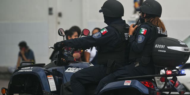 Members of the police on an ATV in Playa del Carmen, Quintana Roo, Mexico, Friday, April 29, 2022.