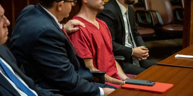 Attorney Phillip Reizenstein places his hand on the shoulder of telenovela star Pablo Lyle as the sentence is read by Judge Marisa Tinkler Mendez at Lyle's sentencing in Miami-Dade Criminal Court in Miami, Friday, Feb. 3, 2023.