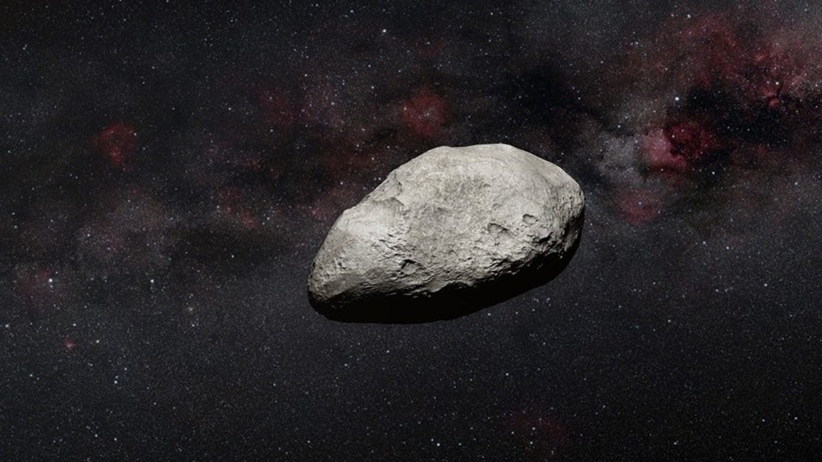 Illustration of a vaguely egg-shaped, pockmarked gray asteroid against a scenic wash of space sprinkled with stars.